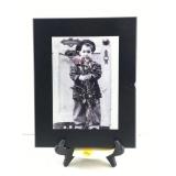 This is a Kim Anderson ï¿½missing youï¿½ framed art