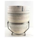 This is a ceramic plant pot with a wood like