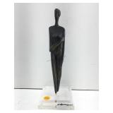 This is a Cycladic style bronze sculpture of a