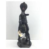 This is a beaded equestrian figure created by the