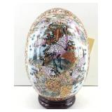 This is a Satsuma style decorative porcelain egg