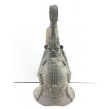 Lower Niger bronze bell featuring a stylized