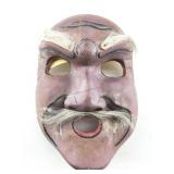This is a vintage Japanese carved wooden mask
