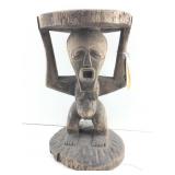 A traditional African Songye Caryatid stool from