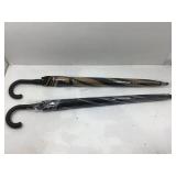 2 large handheld umbrellas