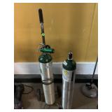 2-Oxygen tanks, one is in stand, CU FT 24