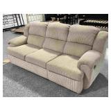 Cream/yellow couch w/one side is recliner,