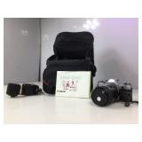 Canon AE one with large canon bag and all