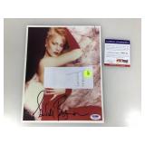 An autographed photo of Sandahl Bergman certified