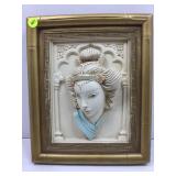 This image shows a vintage 3-D relief wall plaque