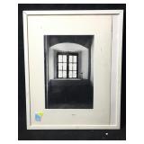 This is a framed black-and-white photograph of a
