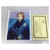 An autographed picture of Dana Carvey with COA