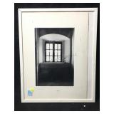 This is a framed black-and-white photograph of a