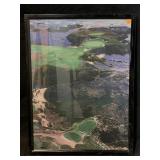 This framed aerial photograph depicts the