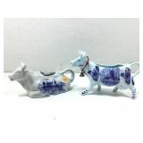 A lot of two cow shaped creamers, both in light