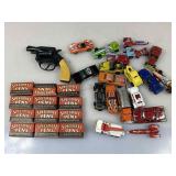A small plastic tub, full of hot wheels cars, a