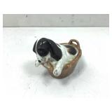 Ceramic cocker spaniel puppy in a clothes basket