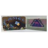 A Joe Camel tin container, depicting Joe shooting