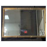 Large beveled glass mirror in very ornate gold