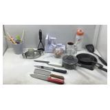 A box slot of kitchen, utensils, and appliances.