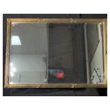 Large beveled glass mirror in very ornate gold