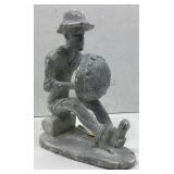 This is a gray stone carving depicting a figure