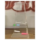 Clear acrylic display. Approx 17x8.