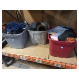 Bin full of assorted clothes incl. shorts, hats,