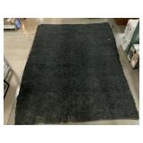 Hand loomed large area rug made of small leather