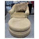 Cream armchair w/rolling footstool, approx 38in