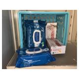 2 New Vinyl Gloves and Disposable Washcloths.