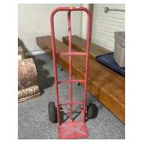 Red metal dolly, only one tire holds air