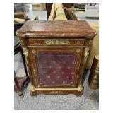 Red stone top curio cabinet w/metal accents,