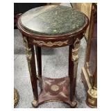 Green marble top round side table, approx 21x33un