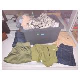 Plastic storage container with clothes, pants and