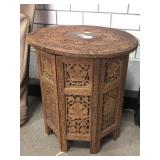 Carved wood round end table w/brass inlay, top