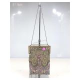 A vintage antique evening bag featuring a gold