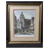 This framed artwork is a vintage hand colored