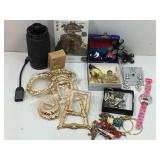 A box lot of various costume jewelry pieces, a