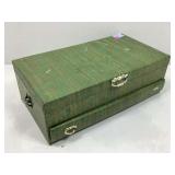 A green and gold jewelry box with various costume