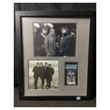This framed a memorabilia piece features three