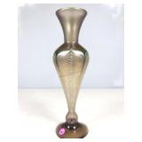 This is an iridescent hand blown art glass vase