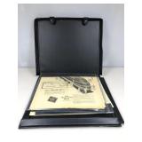 A black plastic carrying case containing