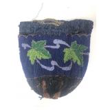 A vintage micro beaded reticule handbag features