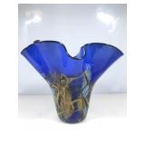 A vibrant, cobalt blue hand blown art, glass