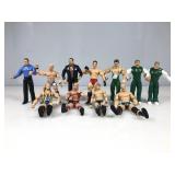 A box lot of 11 wrestling type action figures