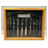 A wooden shadowbox showcase with glass top