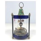 A Chinese mechanical glass cylinder table clock