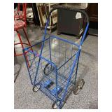 Blue metal folding grocery cart, approx 29in tall