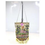 A micro beaded evening bag features a colorful